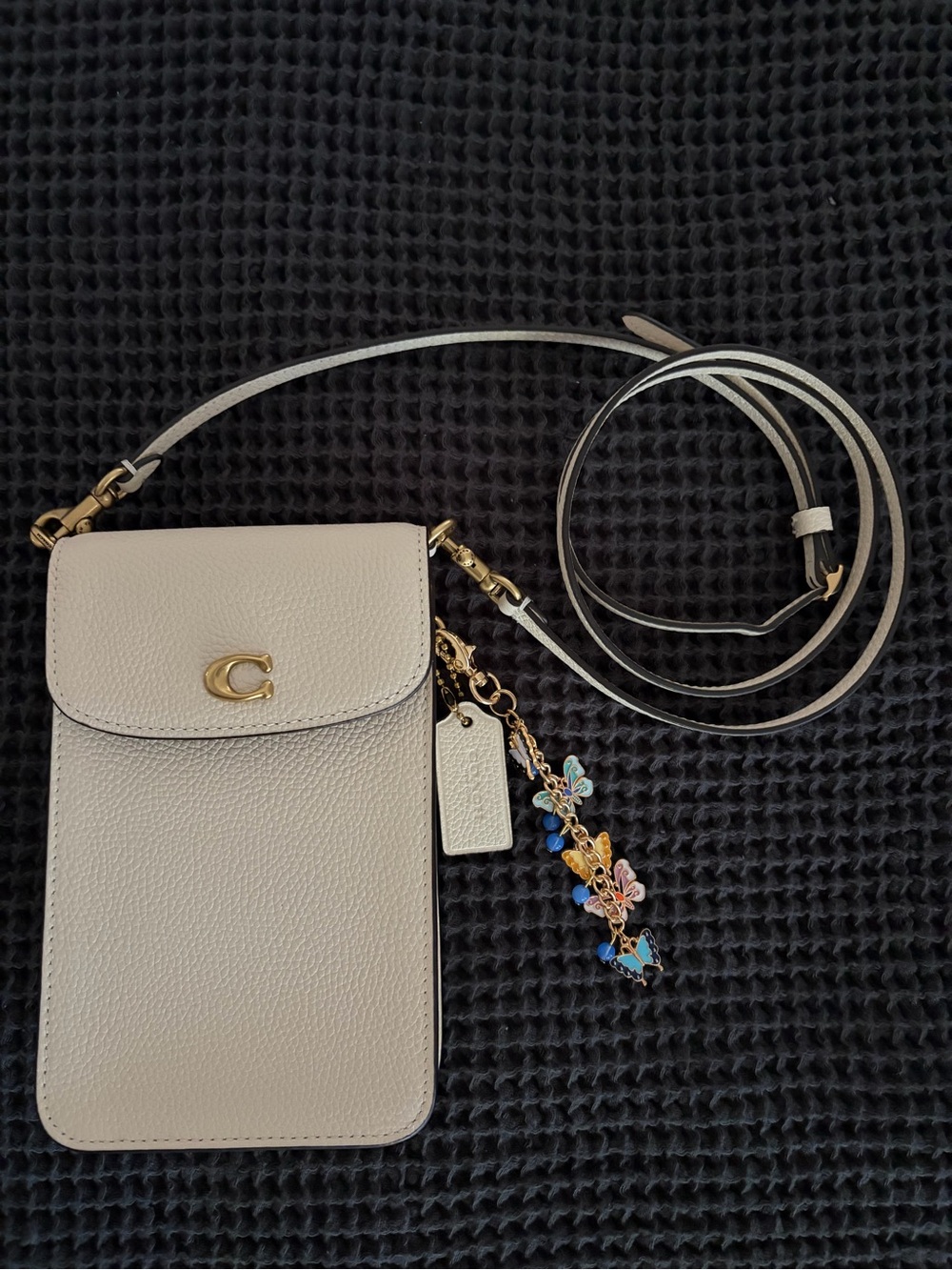 Cream Leather Crossbody Phone Bag with Gold 'C' Accent and Charm